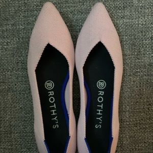 Rothy’s pink business show with pointed toes.